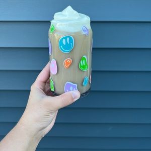 16oz glass cup with multi color funky smiley faces